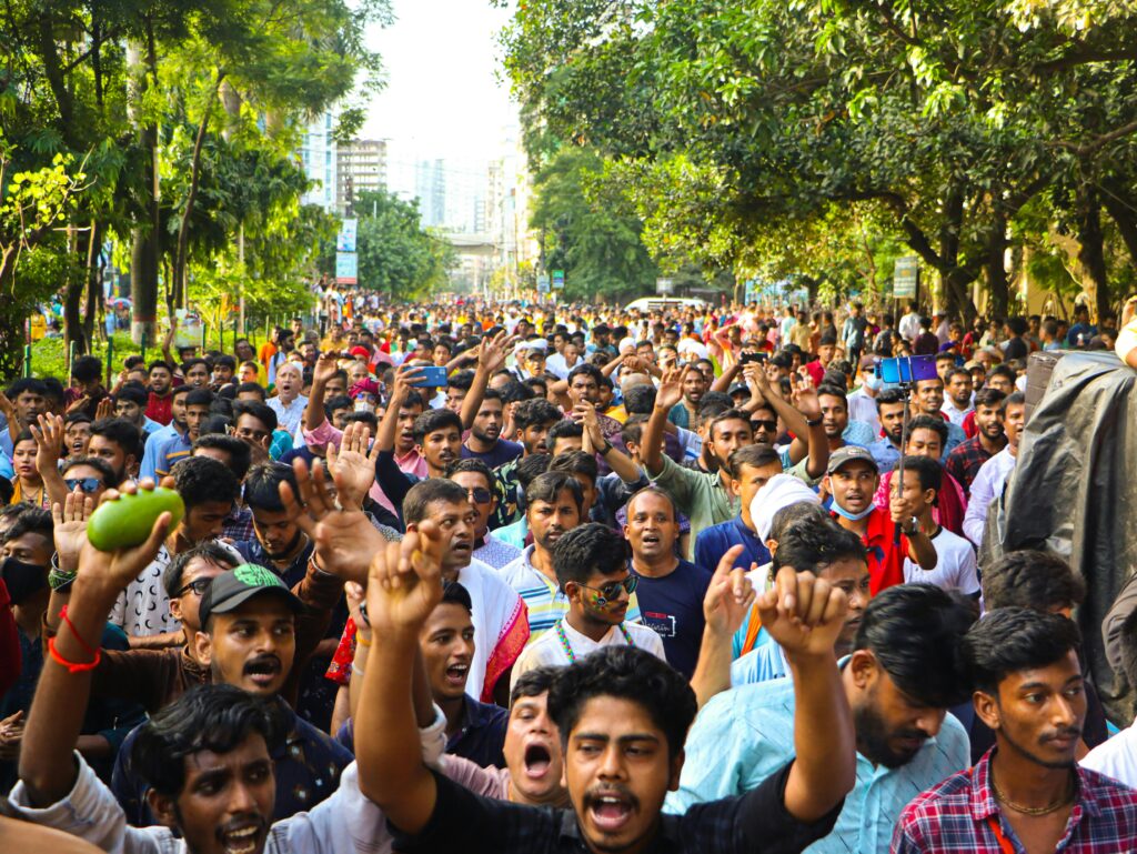 Vibrant crowd during a street protest in Dhaka, highlighting the spirited atmosphere and cultural diversity.