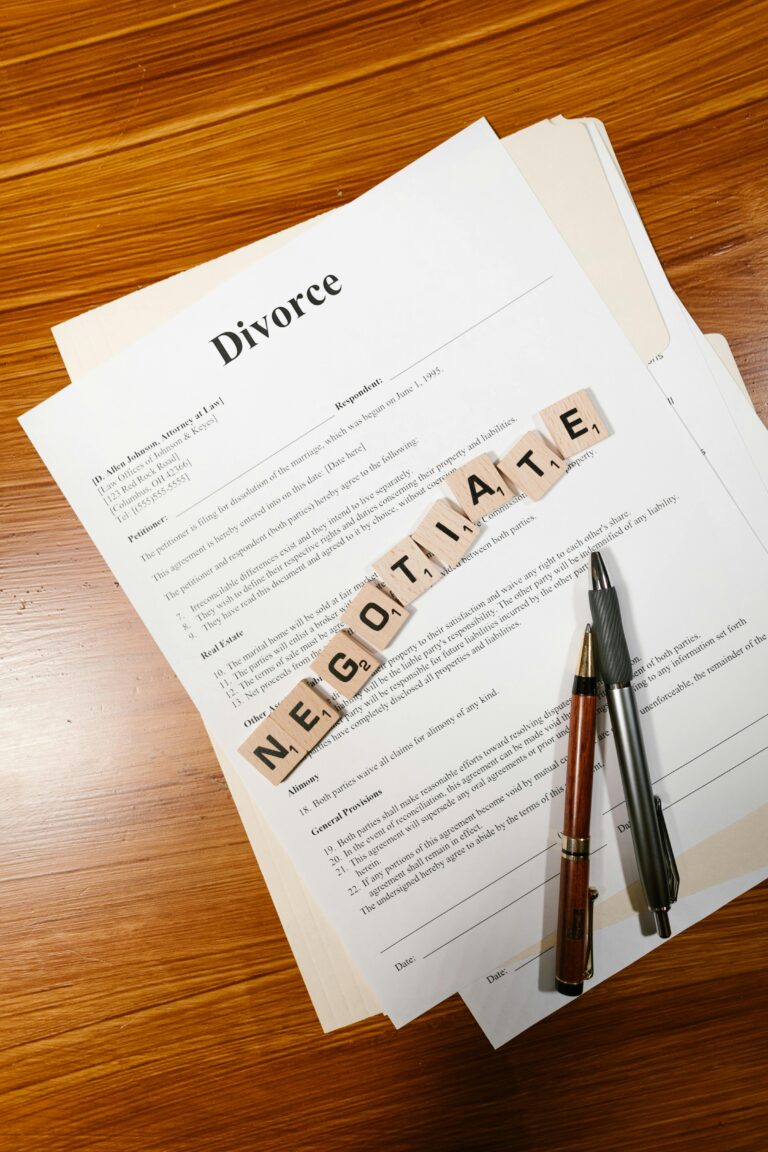 Divorce papers and 'negotiate' tiles symbolize mediation and legal discussions.