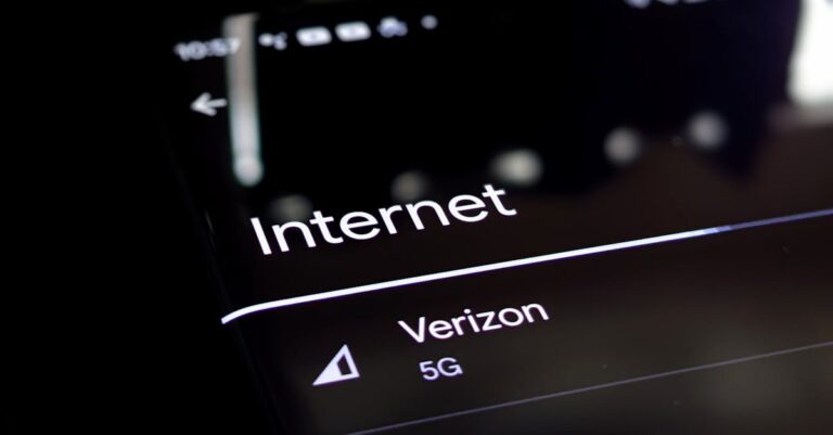 Close-up of a smartphone screen displaying internet connection details with Verizon 5G and Wi-Fi options.