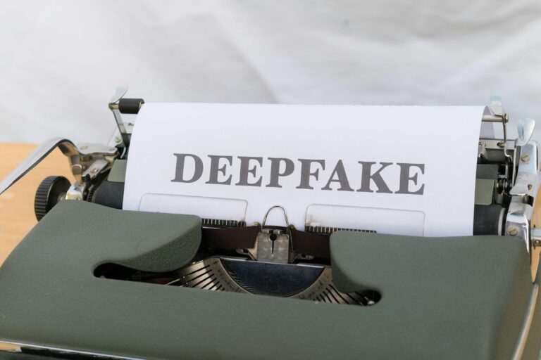 Old-fashioned typewriter with a paper labeled 'DEEPFAKE', symbolizing AI-generated content.