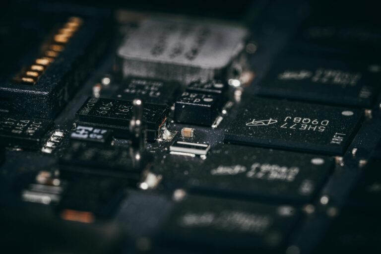 Detailed macro shot of electronic circuit components showcasing intricate design and layout.