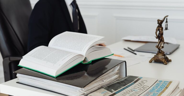 A lawyer sitting at a desk with legal books, documents, and a newspaper, embodying professionalism.