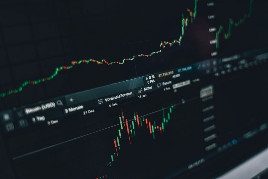 Close-up of a digital market analysis display showing Bitcoin and cryptocurrency price trends.